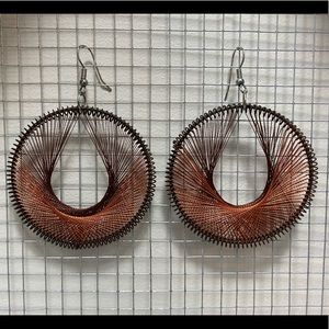 Metal and string brown earrings